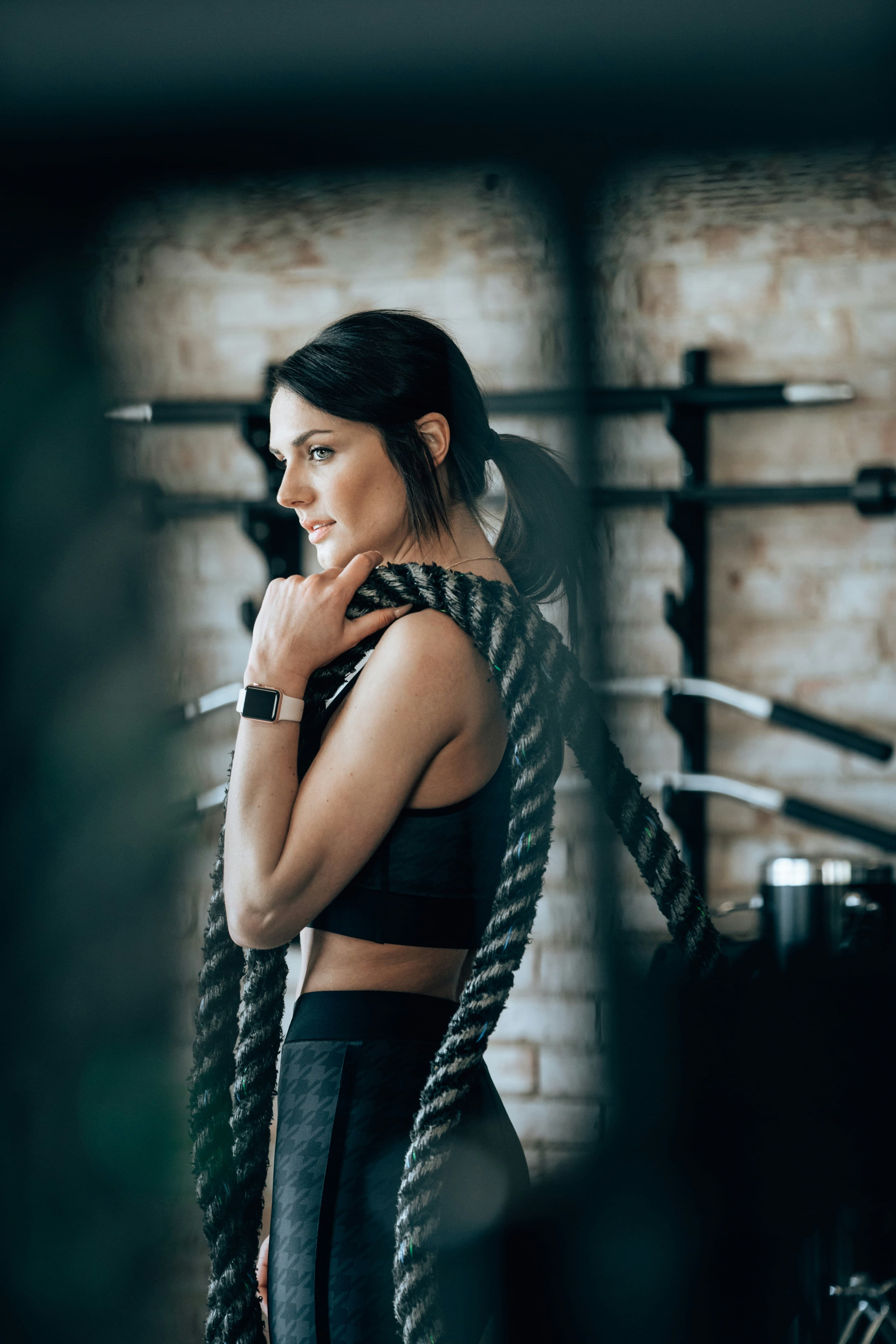 woman with battle rope at the gym