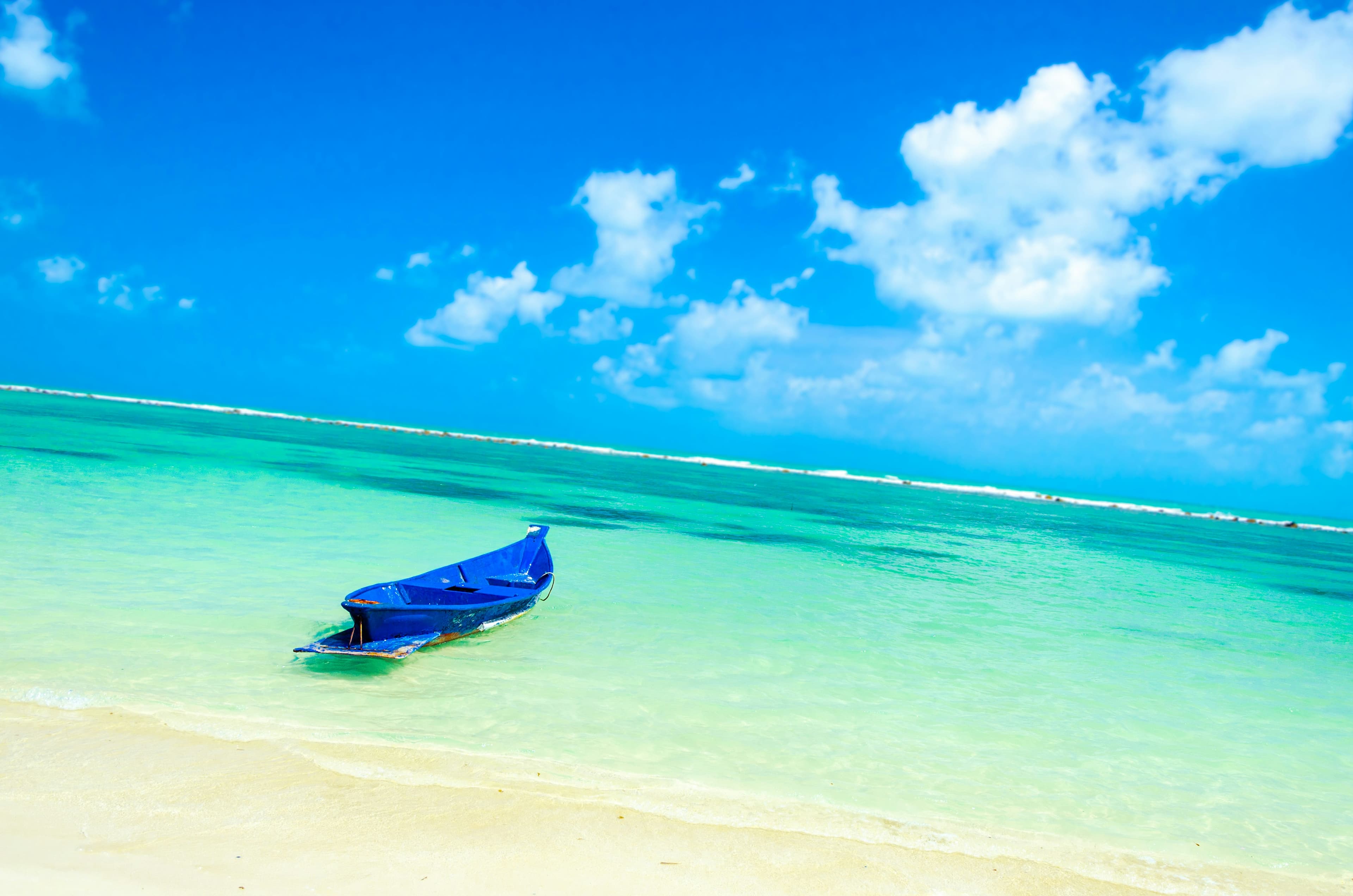 blue boat on turquoise water